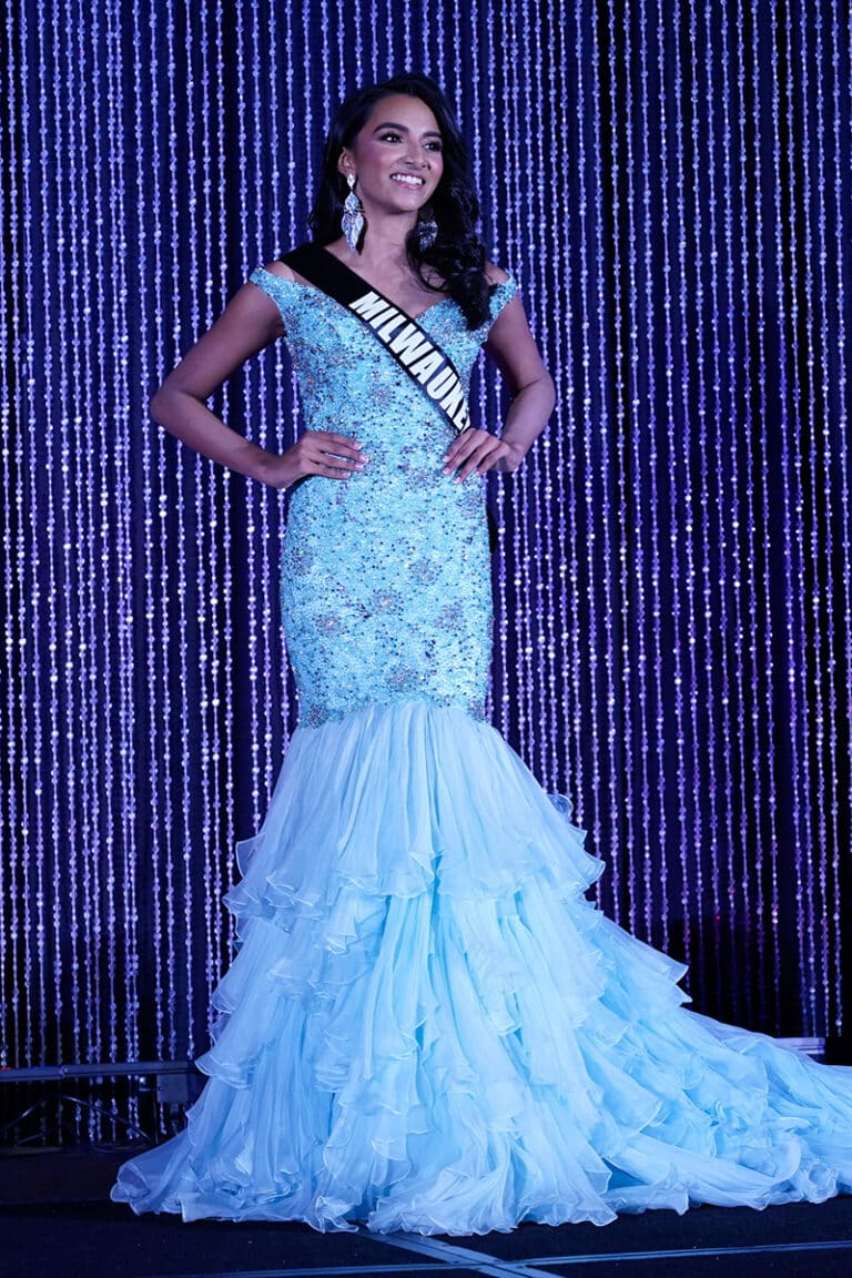 A teenager competing in evening gown in a beauty pageant